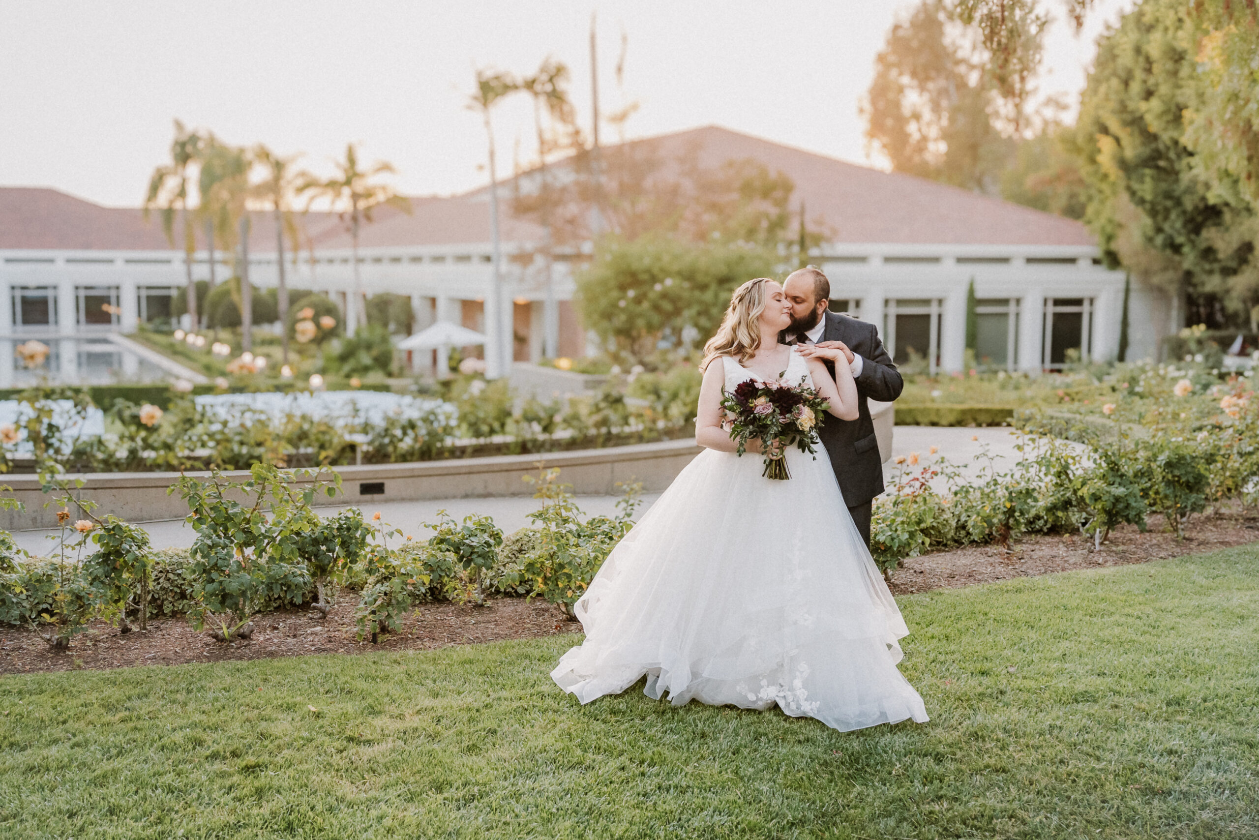 Bride and groom on the lawn during golden hour at the Nixon Library in Yorba Linda