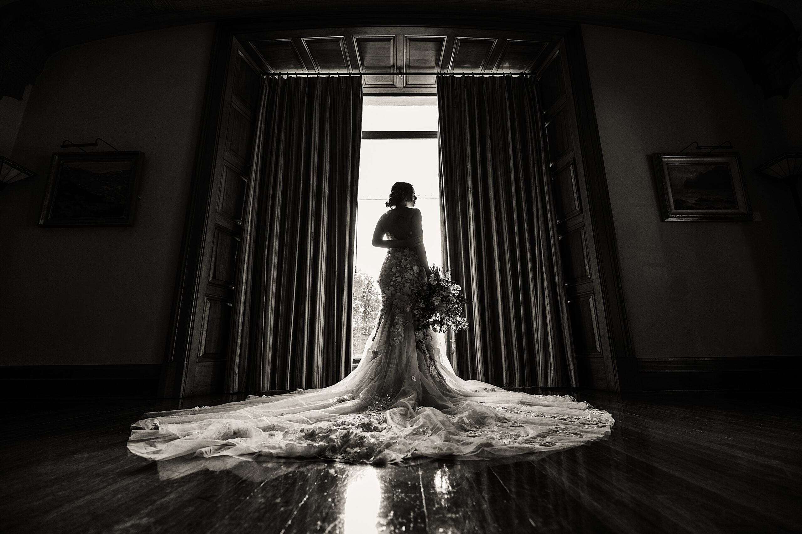 Editorial image of a bride at a window inside of maxwell house pasadena
