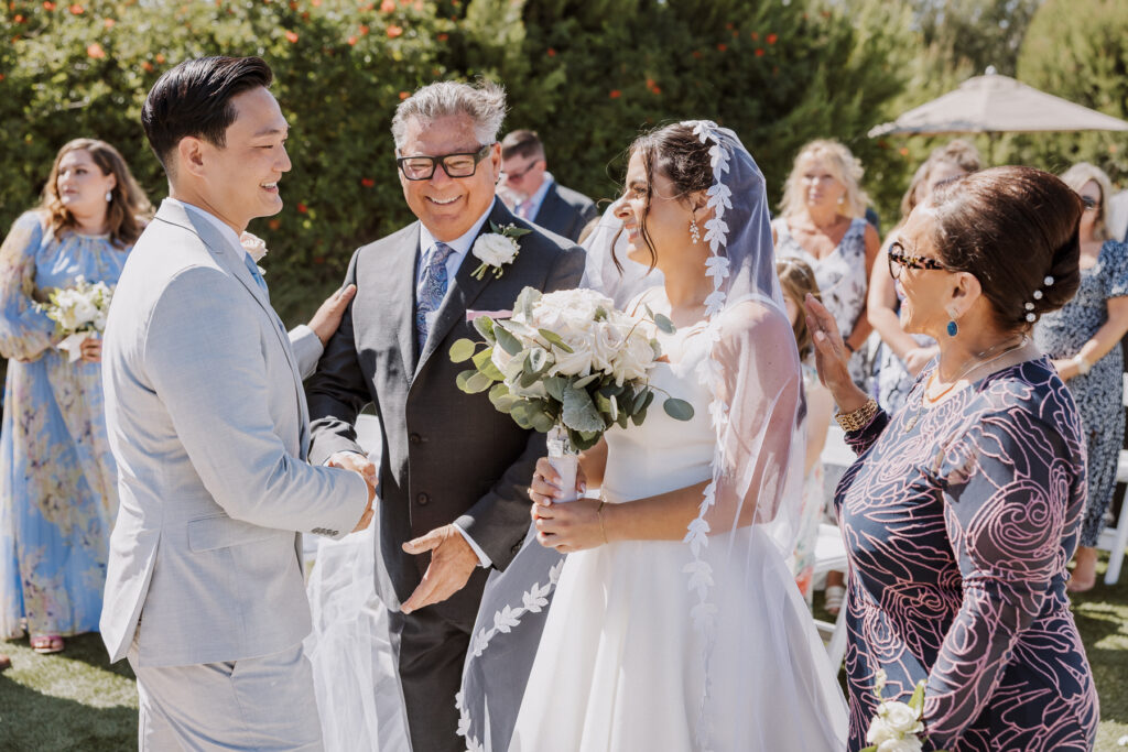 wedding ceremony at terranea resort, mom and bride walking bride down the aisle