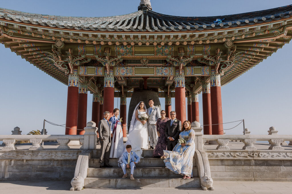 photo of full family on wedding day at the korean friendship bell after terranea