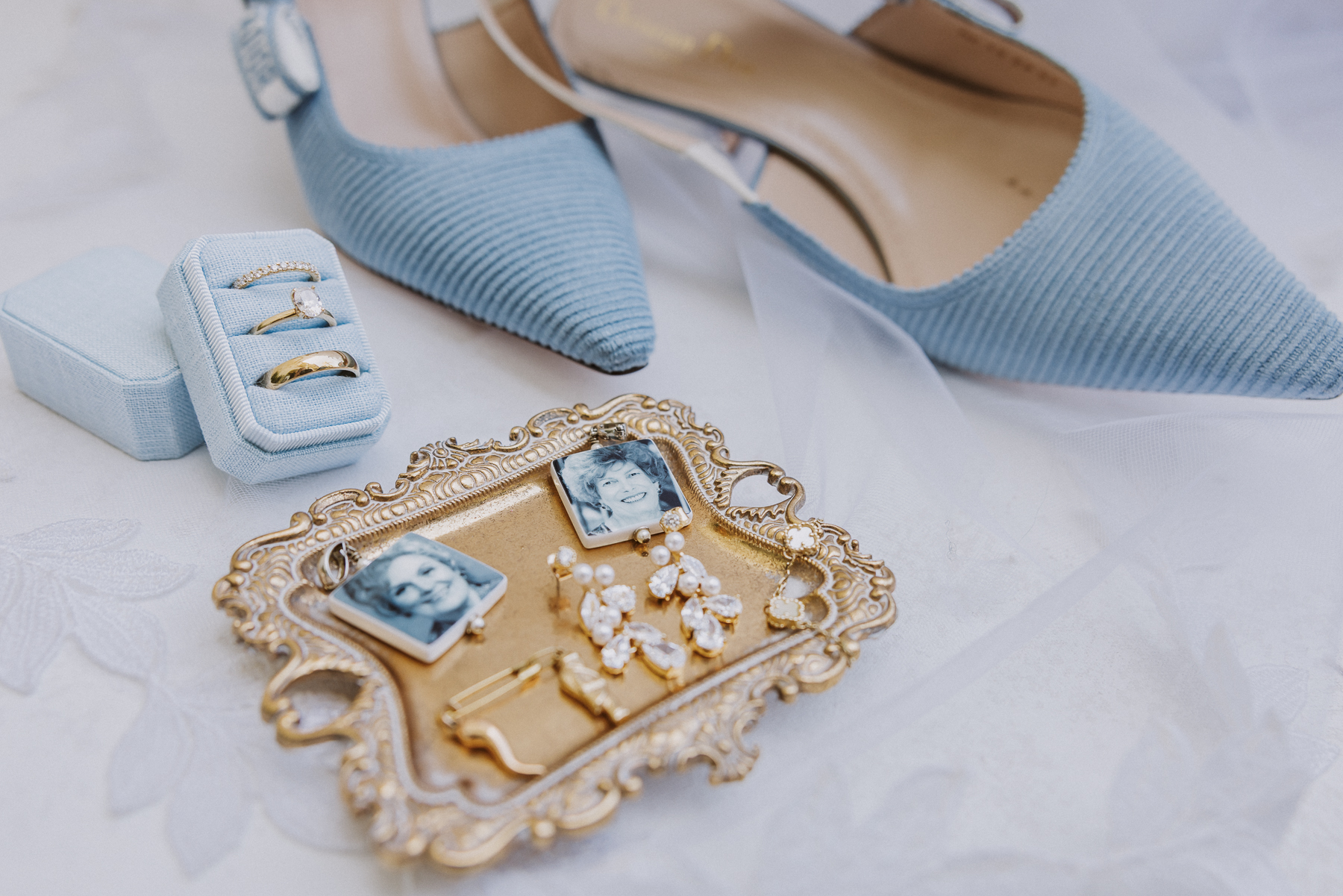 wedding day details with blue dior shoes for the bride, grandmother charms, and jewelry.
