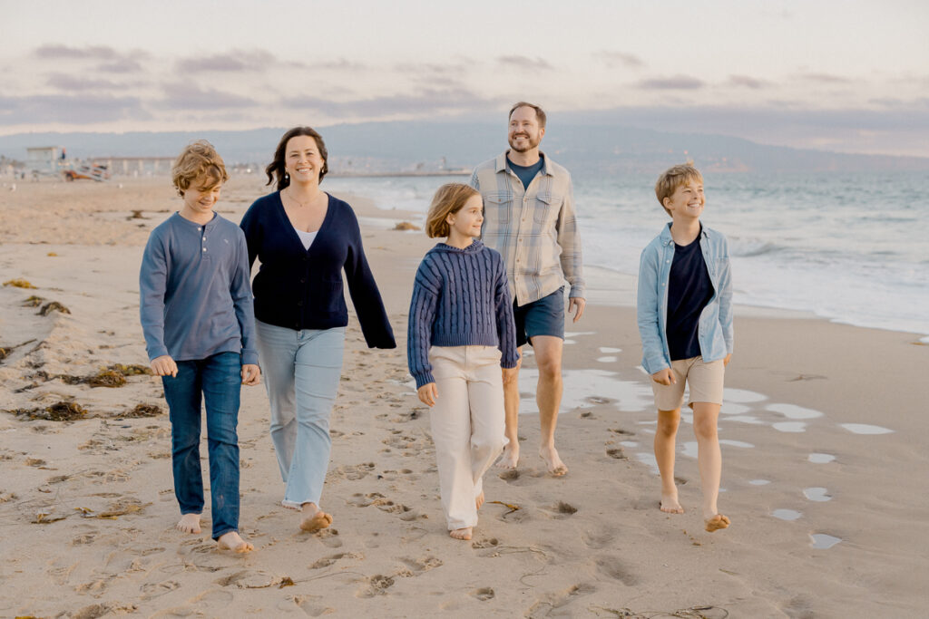 manhattan beach family session with tweens at golden hour, walking candid.